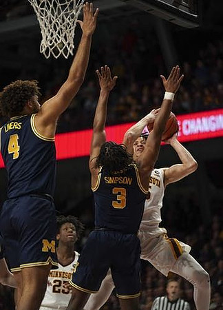 Isaiah Livers (4) and Zavier Simpson (3)