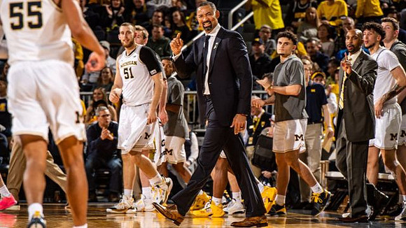 Eli Brooks (55) and Juwan Howard