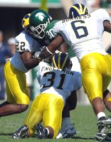Jamar Adams (22), Brandent Englemon (31), and Prescott Burgess (6)