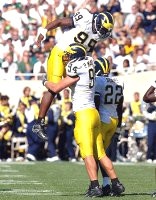 Pierre Woods (99), Pat Massey (94), and Jamar Adams (22)
