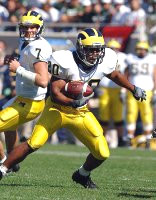 Michael Hart (20) and Chad Henne (7)