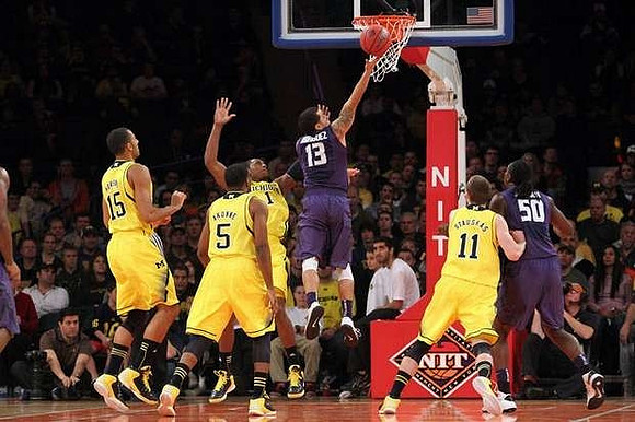 Jon Horford (15), Eso Akunne (5), Glenn Robinson III (1), and Nik Stauskas (11)