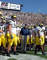 Lloyd Carr, Pat Massey (94), and Darnell Hood (4)