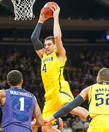 Mitch McGary (4) and Jordan Morgan (52)