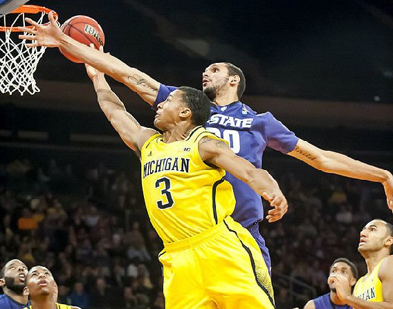 Glenn Robinson III (1), Trey Burke (3), and Jon Horford (15)