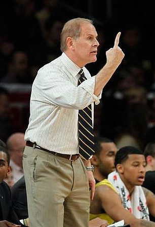 John Beilein, Trey Burke (3), and Jon Horford (15)