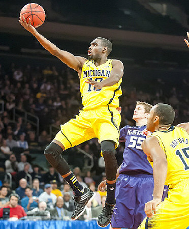 Tim Hardaway Jr. (10) and Jon Horford (15)