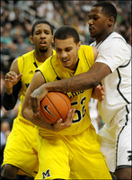 Darius Morris (4) and Jordan Morgan (52)