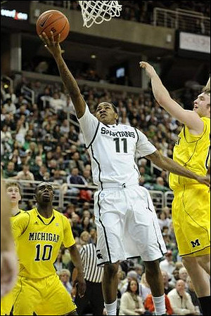Evan Smotrycz (23), Tim Hardaway Jr. (10), and Zack Novak (0)