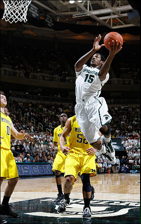 Zack Novak (0), Tim Hardaway Jr. (10), and Jordan Morgan (52)