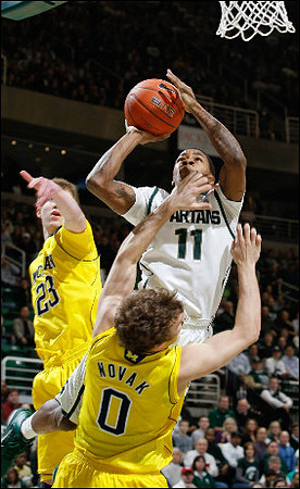 Evan Smotrycz (23) and Zack Novak (0)
