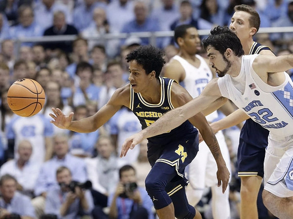 Eli Brooks (55) and Duncan Robinson (22)