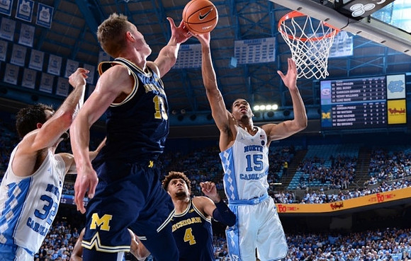 Moritz Wagner (13) and Isaiah Livers (4)