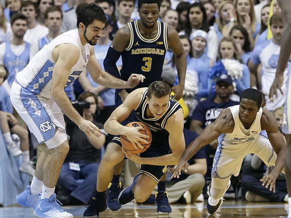 Zavier Simpson (3) and Duncan Robinson (22)