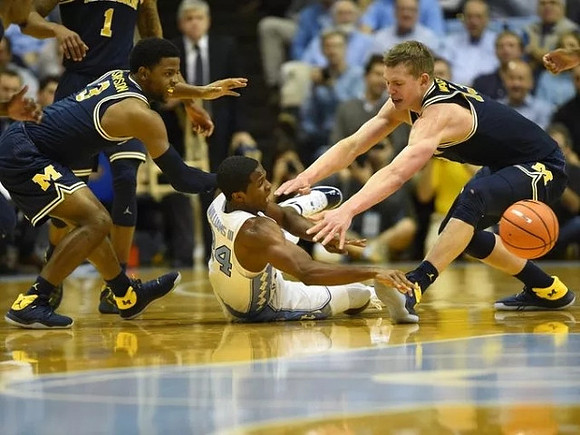 Charles Matthews (1), Zavier Simpson (3), and Moritz Wagner (13)