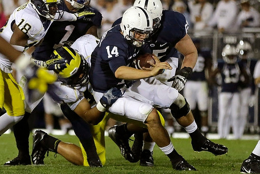 Blake Countess (18) and Chris Wormley (43)