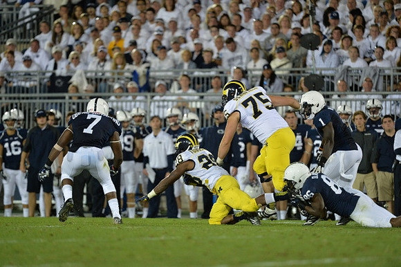 Fitzgerald Toussaint (28) and Michael Schofield (75)