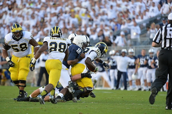 Chris Bryant (58), Fitzgerald Toussaint (28), and Devin Gardner (98)