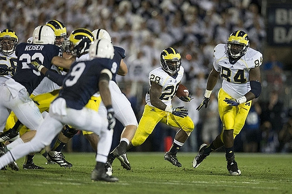 Fitzgerald Toussaint (28) and A.J. Williams (84)