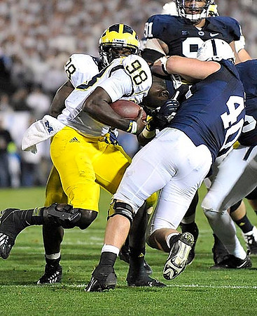 Fitzgerald Toussaint (28) and Devin Gardner (98)