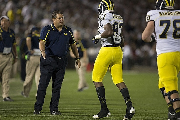 Greg Mattison, Brady Hoke, Devin Funchess (87), and Erik Magnuson (78)