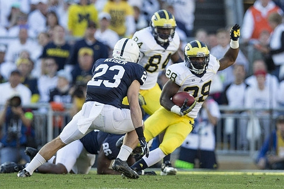 A.J. Williams (84) and Fitzgerald Toussaint (28)