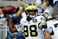Devin Gardner (98) and Taylor Lewan (77)