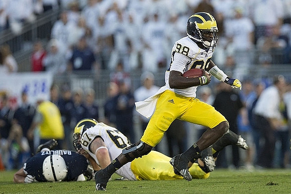 Kyle Kalis (67) and Devin Gardner (98)