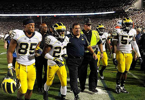 Joe Reynolds (85), Dennis Norfleet (23), Brady Hoke, and Frank Clark (57)
