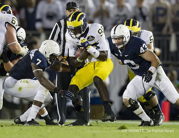 Kyle Kalis (67), Devin Gardner (98), and Chris Bryant (58)