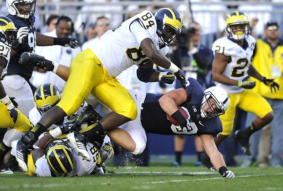 A.J. Williams (84), Chris Bryant (58), Derrick Green (27), Jeremy Gallon (21), and Devin Gardner (98)