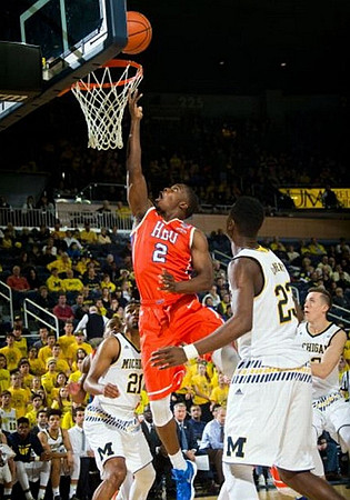 Zak Irvin (21), Caris LeVert (23), and Duncan Robinson (22)