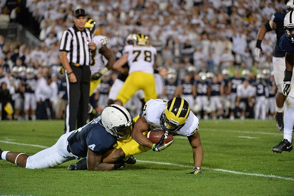 Fitzgerald Toussaint (28), Erik Magnuson (78), and Jeremy Gallon (21)