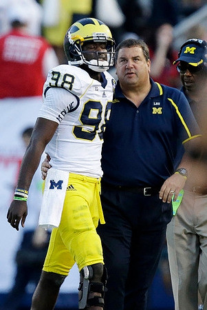 Devin Gardner (98), Brady Hoke, and Fred Jackson
