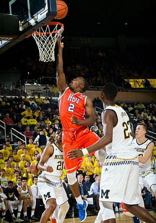 Zak Irvin (21), Caris LeVert (23), and Duncan Robinson (22)