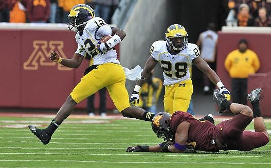 Devin Gardner (12) and Fitzgerald Toussaint (28)