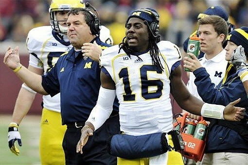Mike Kwiatkowski (81),  Brady Hoke, and Denard Robinson (16)
