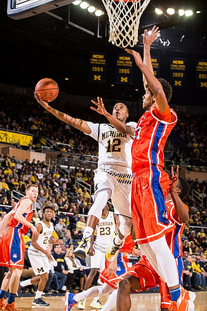 Aubrey Dawkins (24), Caris LeVert (23), and Muhammad-Ali Abdur-Rahkman (12)