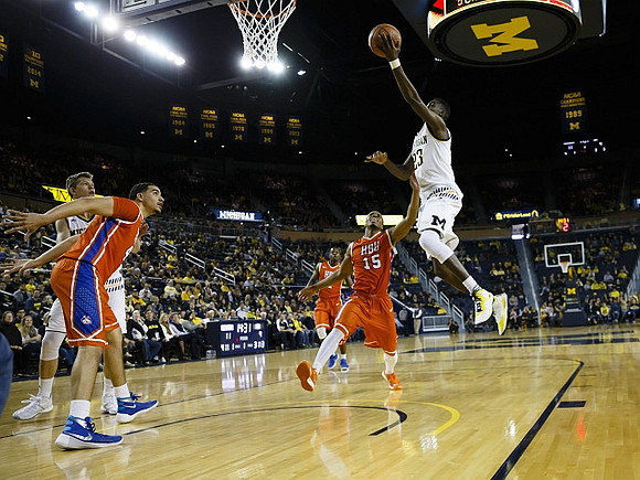 Moritz Wagner (13) and Caris LeVert (23)