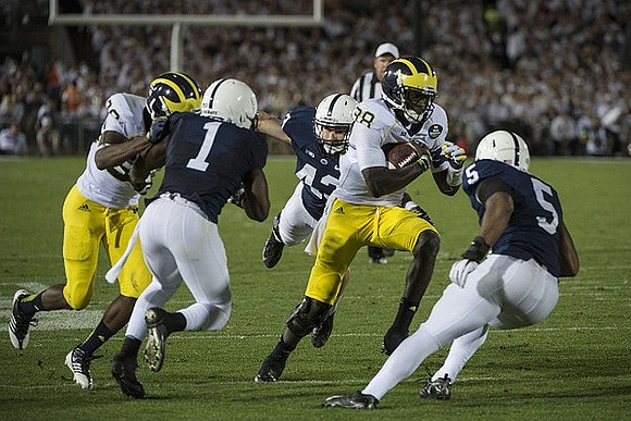 Fitzgerald Toussaint (28) and Devin Gardner (98)