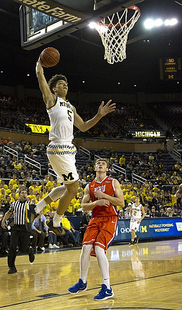 D.J. Wilson (5) and Spike Albrecht (2)