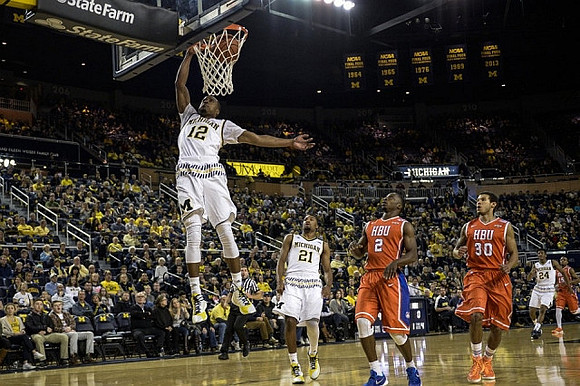 Muhammad-Ali Abdur-Rahkman (12), Zak Irvin (21), and Aubrey Dawkins (24)