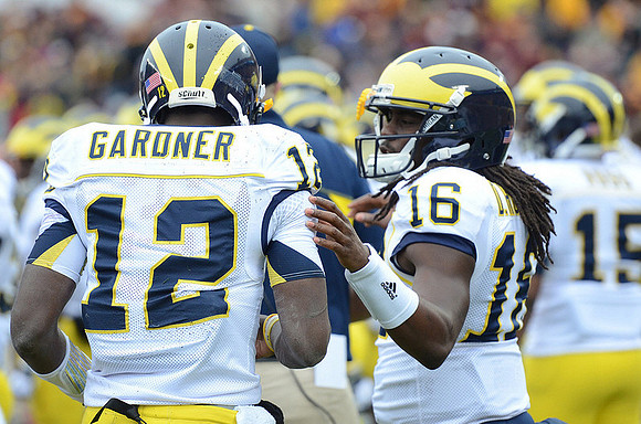 Devin Gardner (12), Denard Robinson (16), and James Ross (15)