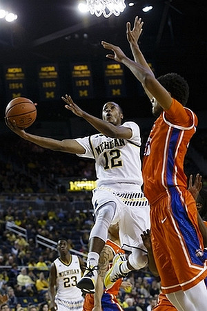 Caris LeVert (23) and Muhammad-Ali Abdur-Rahkman (12)