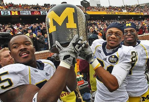 Kenny Demens (25), Roy Roundtree (21), Brandin Hawthorne (7), and The Little Brown Jug
