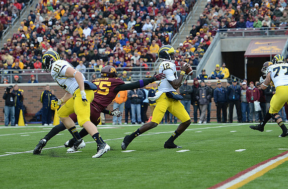 Devin Gardner (12), Taylor Lewan (77), and Mike Kwiatkowski (81)
