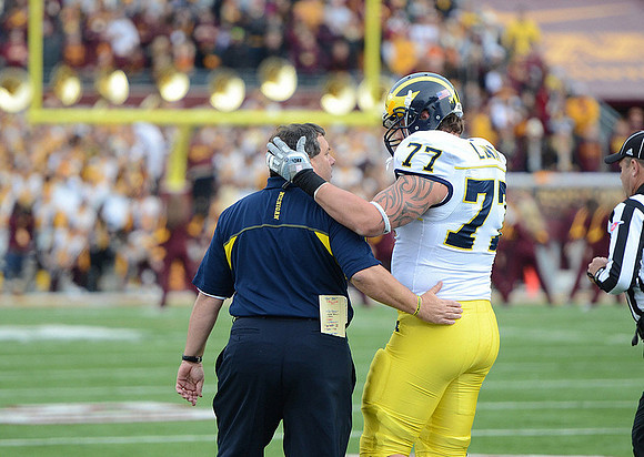 Brady Hoke and Taylor Lewan (77)