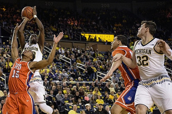 Caris LeVert (23) and Ricky Doyle (32)