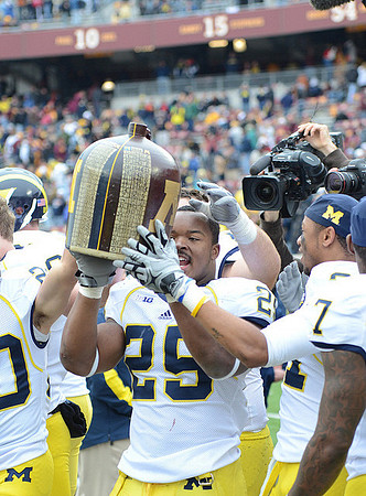 Kenny Demens (25), Roy Roundtree (21), Brandin Hawthorne (7), and The Little Brown Jug