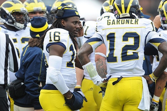 Denard Robinson (16) and Devin Gardner (12)